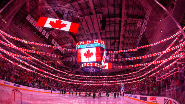 Nov 23, 2021; Dallas, Texas, USA; A view of the arena and the Canadian flag during the playing of the national anthem of Canada before the game between the Dallas Stars and the Edmonton Oilers at the American Airlines Center.