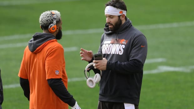Baker Mayfield and Odell Beckham Jr. talk in warm ups before a game.