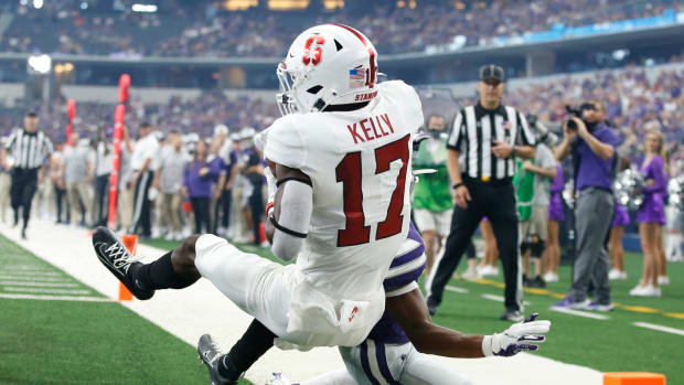 Stanford Cardinal cornerback Kyu Blu Kelly (17) makes an interception against Kansas State Wildcats wide receiver Phillip Brooks (88) in the first quarter at AT&T Stadium.