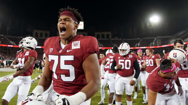 Stanford Cardinal offensive tackle Walter Rouse (75) celebrates after the game against the Washington Huskies at Stanford Stadium.