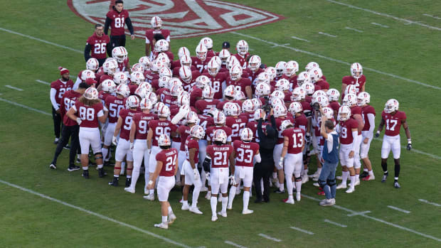 Stanford Cardinal players huddle before the start of the game against the California Golden Bears at Stanford Stadium.
