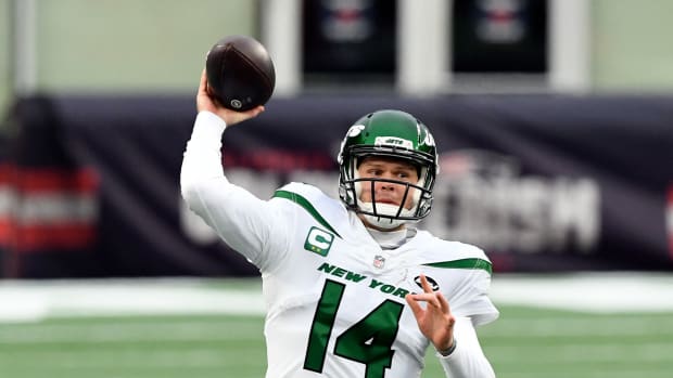 Jan 3, 2021; Foxborough, Massachusetts, USA; New York Jets quarterback Sam Darnold (14) throws the ball against the New England Patriots during the second quarter at Gillette Stadium. Mandatory Credit: Brian Fluharty-USA TODAY Sports