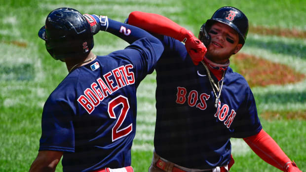 Boston Red Sox center fielder Alex Verdugo (99) celebrates with shortstop Xander Bogaerts (2) after hitting a three run home run against the Baltimore Orioles at Oriole Park at Camden Yards.