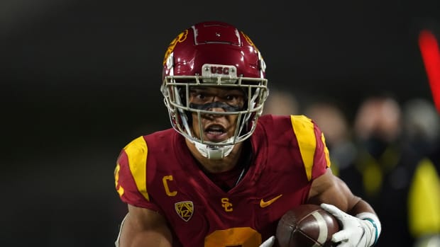 Southern California Trojans wide receiver Amon-Ra St. Brown (8) scores on a 47-yard touchdown reception in the first quarter against the Oregon Ducks during the Pac-12 Championship at United Airlines Field at Los Angeles Memorial Coliseum.