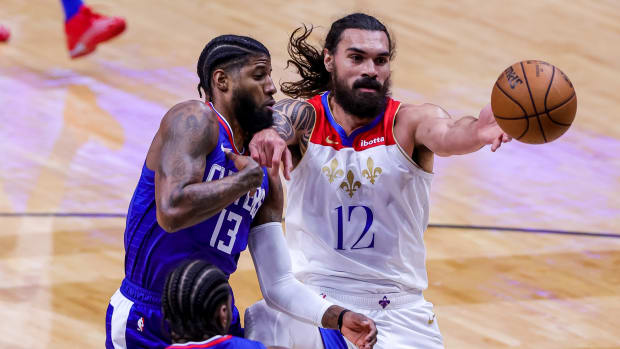 Mar 14, 2021; New Orleans, Louisiana, USA; New Orleans Pelicans center Steven Adams (12) blocks LA Clippers guard Paul George (13) from getting a rebound during the first half at the Smoothie King Center. Mandatory Credit: Stephen Lew-USA TODAY Sports