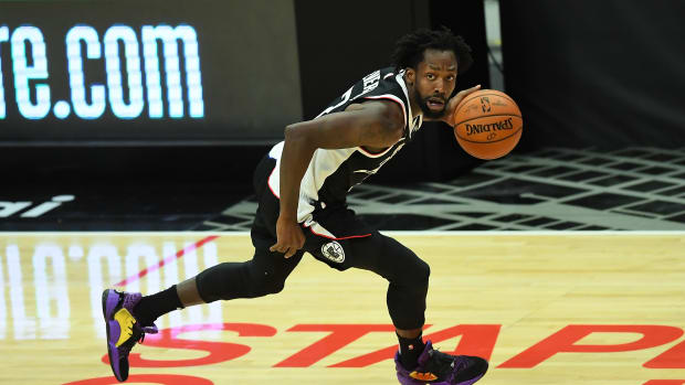Feb 19, 2021; Los Angeles, California, USA; Los Angeles Clippers guard Patrick Beverley (21) takes the ball down court in the first half of the game against the Utah Jazz at Staples Center. Mandatory Credit: Jayne Kamin-Oncea-USA TODAY Sports