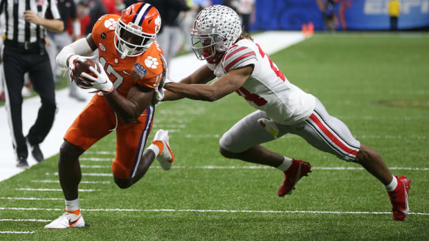 Jan 1, 2021; New Orleans, LA, USA; Clemson Tigers wide receiver Cornell Powell (17) runs the ball past Ohio State Buckeyes cornerback Shaun Wade (24) during the second half at Mercedes-Benz Superdome. Mandatory Credit: Chuck Cook-USA TODAY Sports