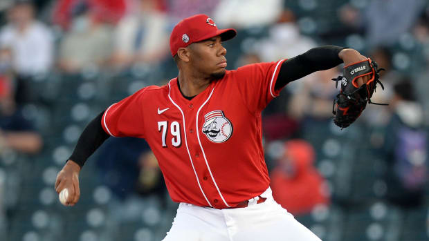 Reds' Hunter Greene delivers a pitch
