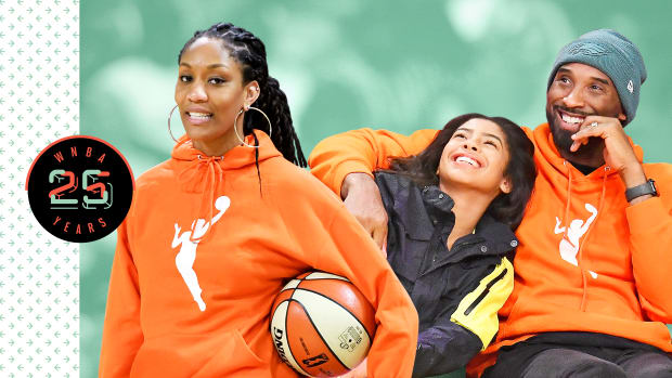 A'ja Wilson, Gianna Bryant and Kobe Bryant. Wilson and Kobe are wearing orange WNBA hoodies