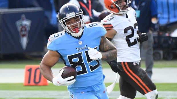 Tennessee Titans tight end MyCole Pruitt (85) runs in a touchdown after a catch past Cleveland Browns free safety Andrew Sendejo (23) during the third quarter at Nissan Stadium Sunday, Dec. 6, 2020 in Nashville, Tenn.