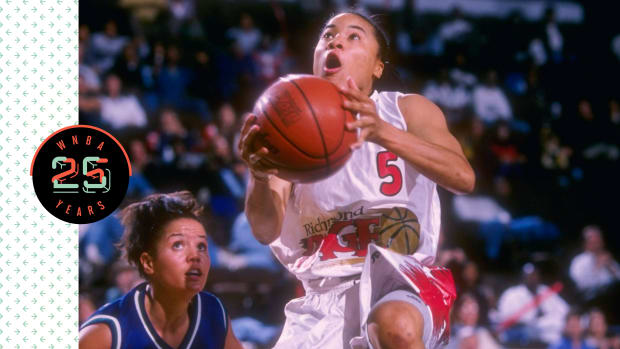 Dawn Staley holding a basketball