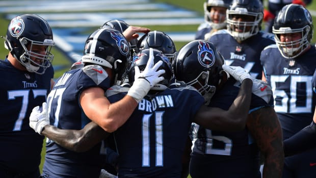 Tennessee Titans wide receiver A.J. Brown (11) celebrates with teammates after a touchdown catch against the Baltimore Ravens during the first quarter in a AFC Wild Card playoff game at Nissan Stadium.