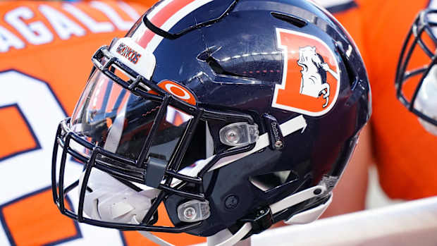 Dec 19, 2020; Denver, Colorado, USA; A general view of the Denver Broncos helmet on sidelines against the Buffalo Bills during the second quarter at Empower Field at Mile High.
