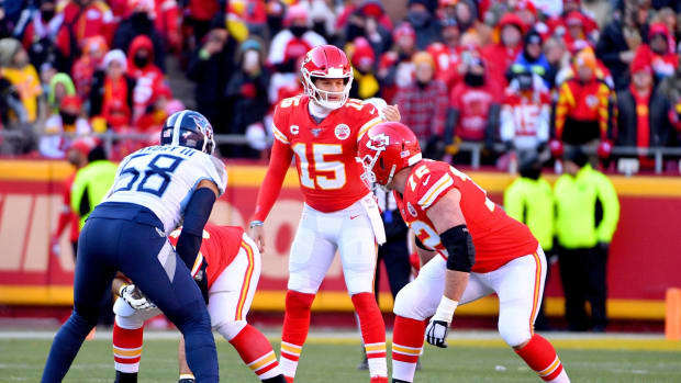 Kansas City Chiefs quarterback Patrick Mahomes (15) gestures on the line of scrimmage during the AFC Championship Game against the Tennessee Titans at Arrowhead Stadium.