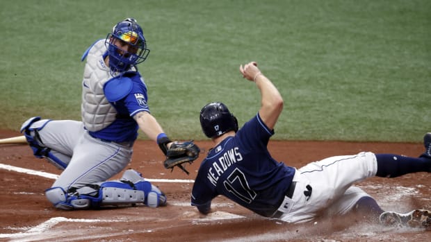 May 27, 2021; St. Petersburg, Florida, USA; Tampa Bay Rays designated hitter Austin Meadows (17) scores a run as he slides in safe at home plate ad Kansas City Royals catcher Cam Gallagher (36) attempted to tag him out during the first inning at Tropicana Field. Mandatory Credit: Kim Klement-USA TODAY Sports