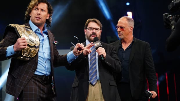 Kenny Omega, Tony Schiavone and Don Callis in the ring on AEW Dynamite