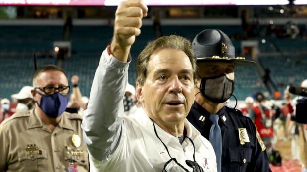 Alabama head coach Nick Saban waves to fans after Alabama defeated Ohio State 52-24 to win the College Football Playoff National Championship Game in Hard Rock Stadium.