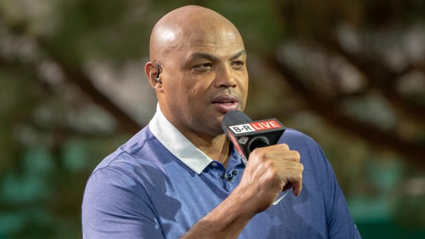 Closeup of NBA analyst Charles Barkley holding a microphone