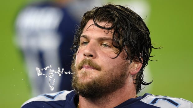 Tennessee Titans offensive tackle Taylor Lewan (77) spits out water during the third quarter at Nissan Stadium Tuesday, Oct. 13, 2020 in Nashville, Tenn.