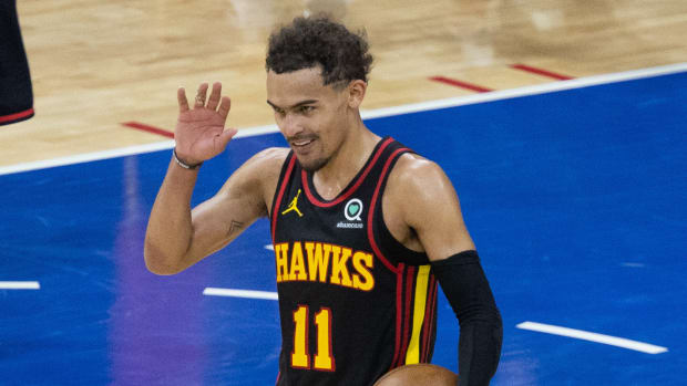 Atlanta Hawks guard Trae Young (11) reacts with fans in the closing seconds of a victory against the Philadelphia 76ers in game seven of the second round of the 2021 NBA Playoffs
