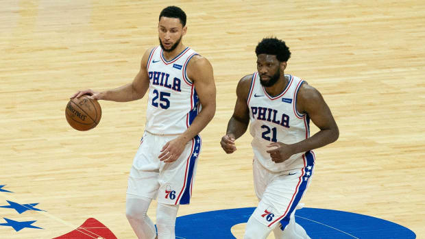 Philadelphia 76ers guard Ben Simmons (25) and center Joel Embiid (21) bring the ball up court against the Atlanta Hawks during the second quarter of game seven