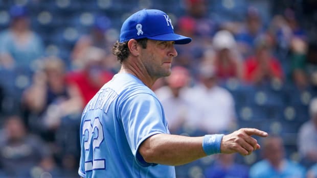 Jun 20, 2021; Kansas City, Missouri, USA; Kansas City Royals manager Mike Matheny (22) signals to the bullpen as he comes to the mound to make a pitcher change in the eighth inning against the Boston Red Sox at Kauffman Stadium. Mandatory Credit: Denny Medley-USA TODAY Sports