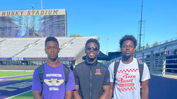 Former Husky back Deontae Cooper returns to Husky Stadium with his players, including UW target Marquawn McCraney at left.