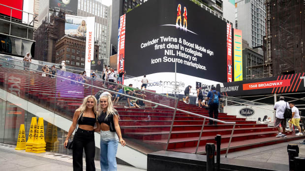 The Cavinder twins pose in Times Square