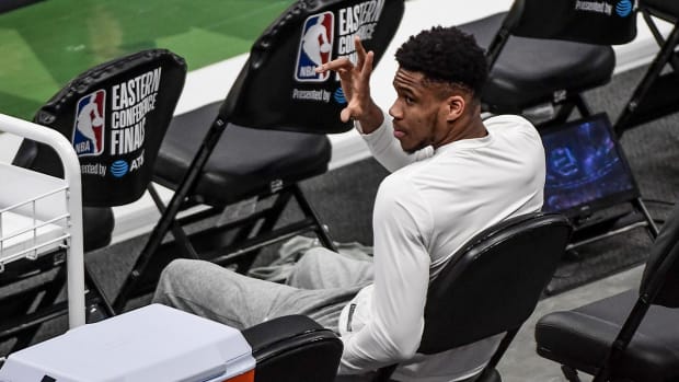 Giannis Antetokounmpo on the bench for the Bucks.