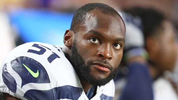 Barkevious Mingo looks up from the bench during a 2018 Seattle Seahawks game