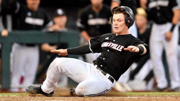 Louisville catcher Henry Davis scores against Vanderbilt during the seventh inning of the College World Series game at TD Ameritrade Park Friday.