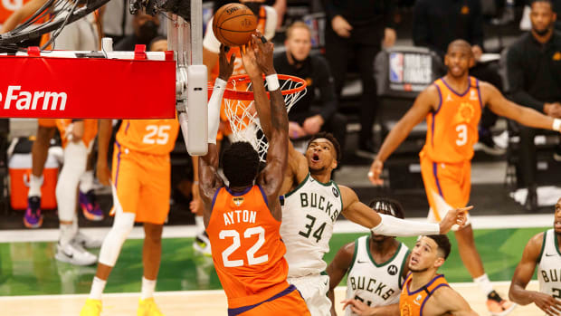 Milwaukee Bucks forward Giannis Antetokounmpo defends Phoenix Suns center Deandre Ayton during the fourth quarter during game four of the 2021 NBA Finals.