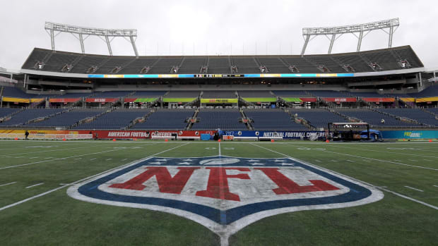 NFL logo at midfield in an empty stadium
