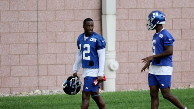 Giants wide receivers John Ross (12) and Derrick Dillon are shown as they walk off the practice field, in East Rutherford.