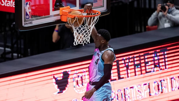 Miami Heat guard Victor Oladipo slam-dunks