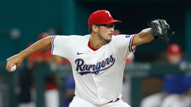 Aug 2, 2021; Arlington, Texas, USA; Texas Rangers starting pitcher Dane Dunning (33) pitches in the first inning against the Los Angeles Angels at Globe Life Field.