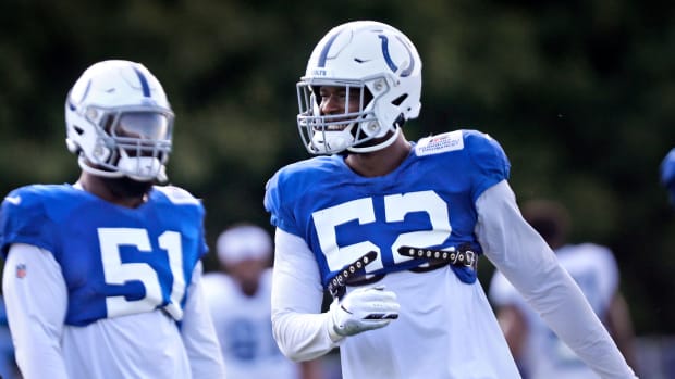 Colts' #52, Ben Banogu, right, joins teammates in stretching before Colts training camp practice Tuesday, Aug. 3, 2021 at Grand Park in Westfield. Colts Training Camp