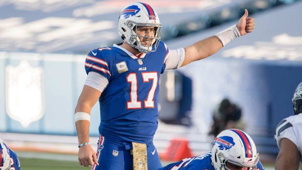 Josh Allen gives a thumbs-up gesture at the line of scrimmage during a 2020 game against the Seahawks