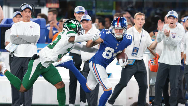 Aug 14, 2021; East Rutherford, New Jersey, USA; New York Giants wide receiver David Sills (84) is tackled by New York Jets cornerback Lamar Jackson (38) during the first half at MetLife Stadium.