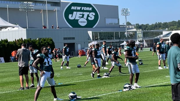 Jalen Reagor and the Eagles stretch at the Jets practice facility