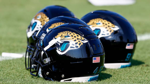 Jacksonville Jaguars helmets sitting on the field