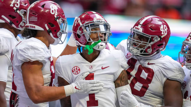 Alabama's Jameson Williams reacts after he scored a touchdown vs Miami