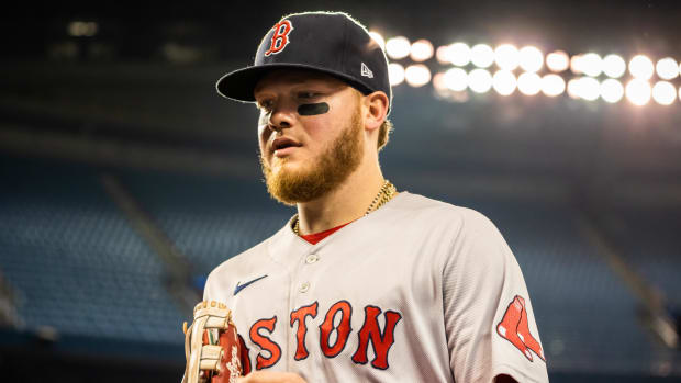 Boston Red Sox left fielder Alex Verdugo (99) returns to the dugout at an MLB game against the Toronto Blue Jays at Rogers Centre.
