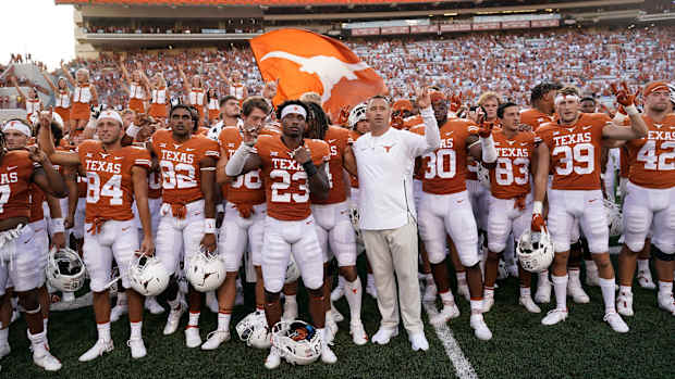 Texas football players sing The Eyes of Texas.