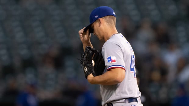 Sep 10, 2021; Oakland, California, USA; Texas Rangers starting pitcher Glenn Otto (49) reacts during the second inning against the Oakland Athletics at RingCentral Coliseum.