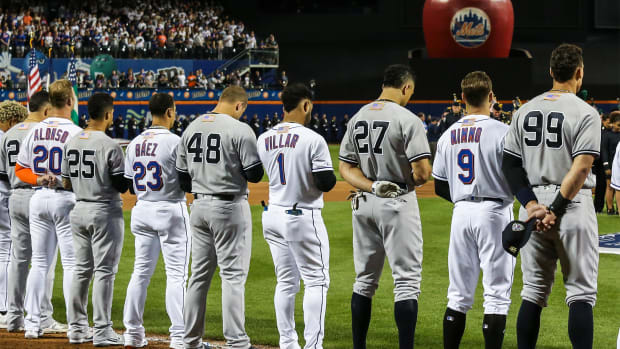 Sep 11, 2021; New York City, New York, USA; Members of the New York Yankees and New York Mets line up next to each other during the September 11 pre-game ceremonies at Citi Field.