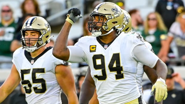 Cameron Jordan of the Saints and defensive teammates take the field
