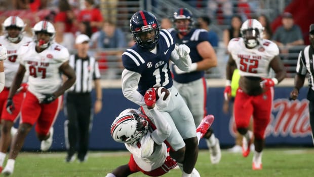 Sep 11, 2021; Oxford, Mississippi, USA; Mississippi Rebels wide receiver Dontario Drummond (11) runs the ball against Austin Peay Governors defensive back Kory Chapman (6) during the first quarter at Vaught-Hemingway Stadium.