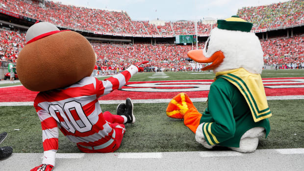 The Ohio State and Oregon mascots take in Saturday's game in Columbus