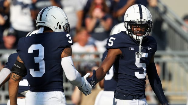 Penn State's Jahan Dotson is congratulated by WR Parker Washington